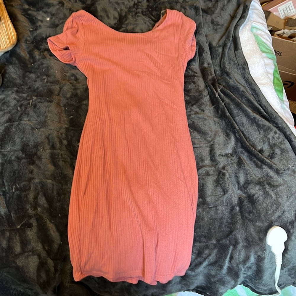 Pink form fitting open back dress